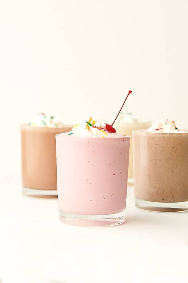 four milkshakes in cups