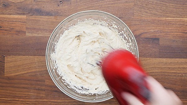 sour cream, mayo, cream cheese, and other ingredients mixed in bowl