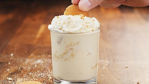 banana pudding being served in cup