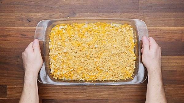 crackers sprinkled over chicken mixture in baking dish