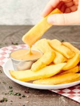 fry being dipped in fry sauce