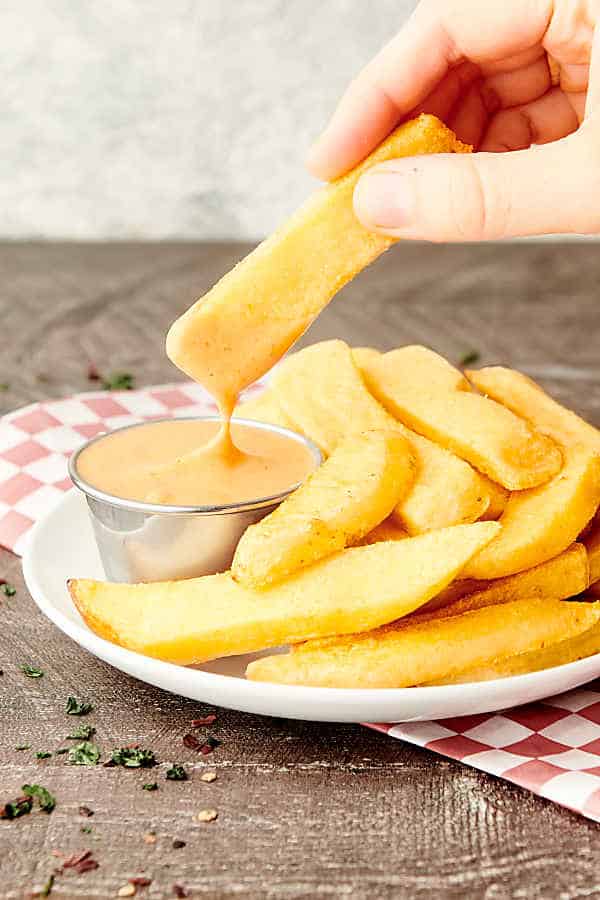 fry being dipped in fry sauce