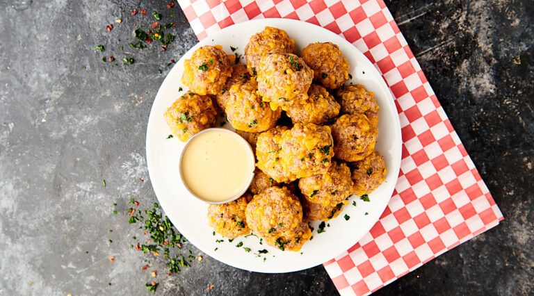 sausage balls on plate above