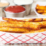 air fryer french fries in paper dish side view
