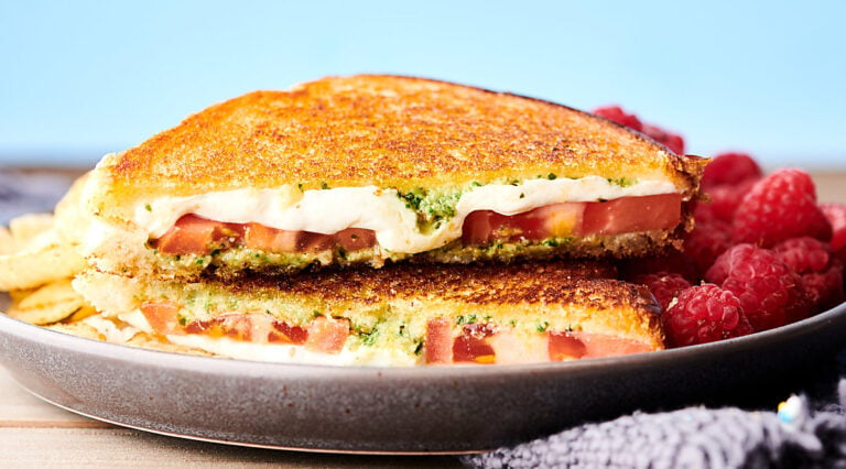 caprese grilled cheese sandwich on plate