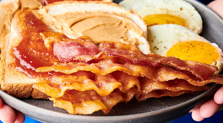 bacon on plate with toast and eggs