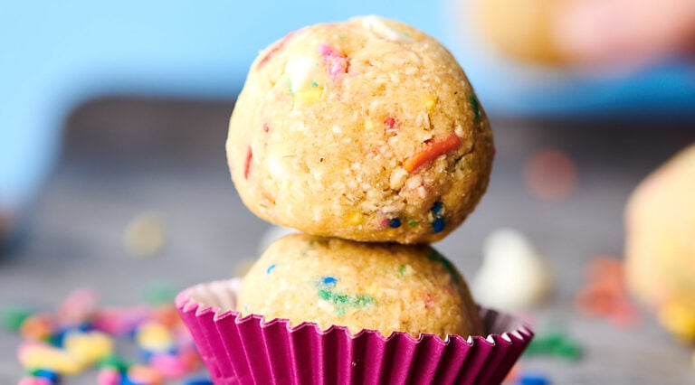two balls of funfetti edible cookie dough stacked