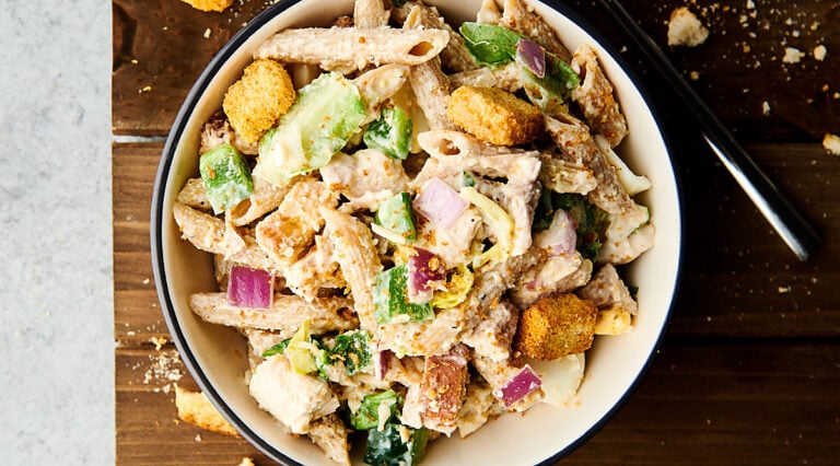 healthy chicken caesar pasta salad bowl above