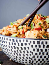chopsticks in bowl of instant pot chicken fried rice