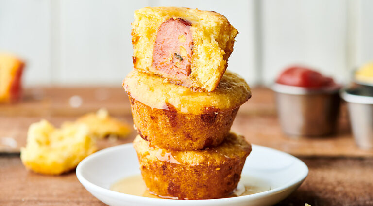 jalapeno cheddar sausage corn muffins stacked on plate