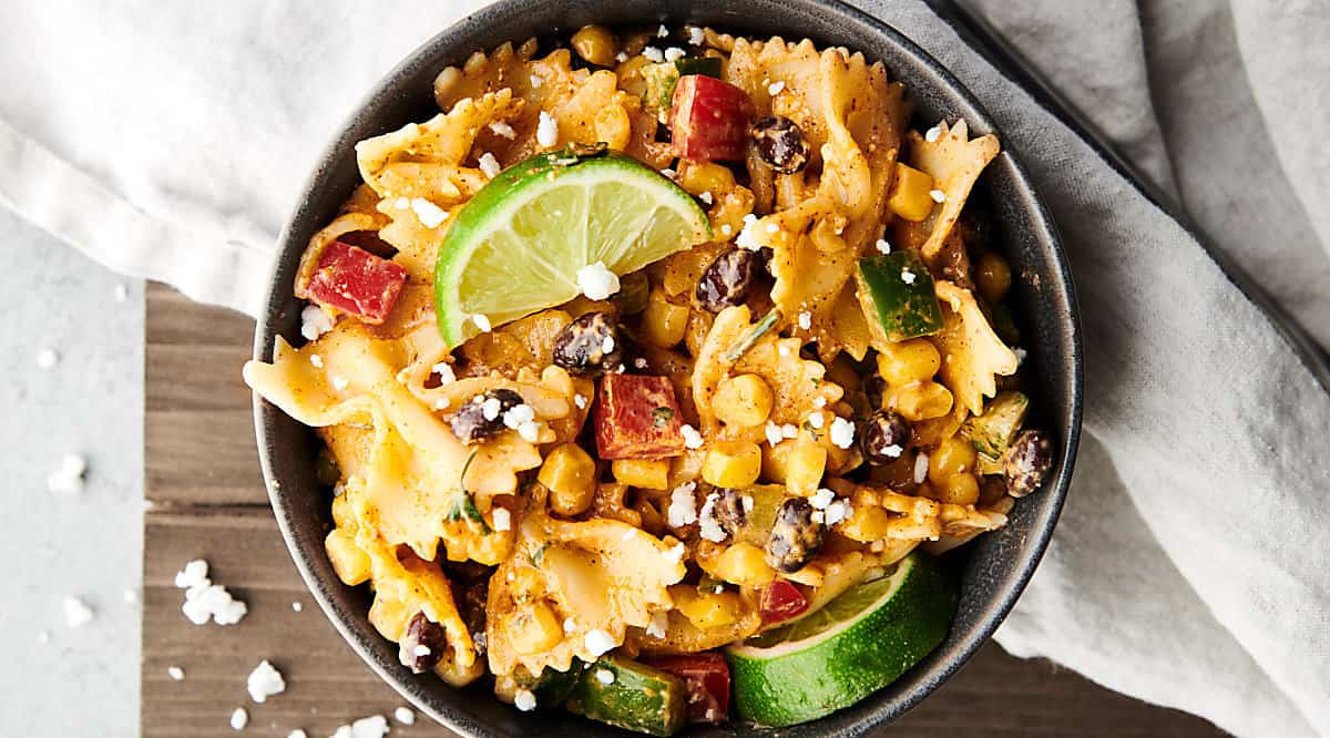 bowl of mexican street corn pasta salad above