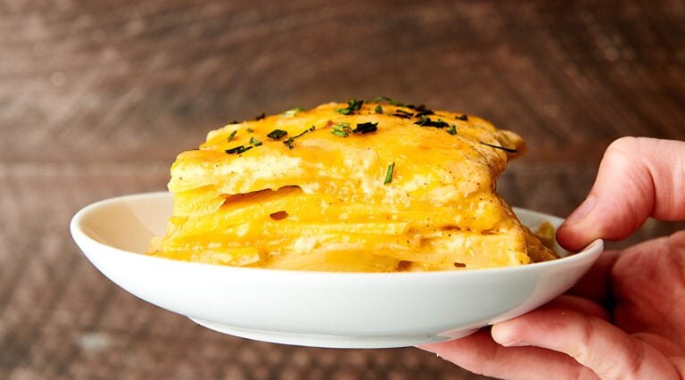 plate of scalloped potatoes held