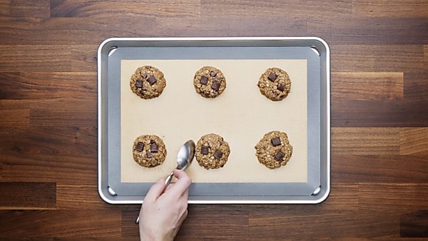 finished vegan oatmeal cookies on baking sheet
