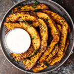 air fryer potato wedges on plate above