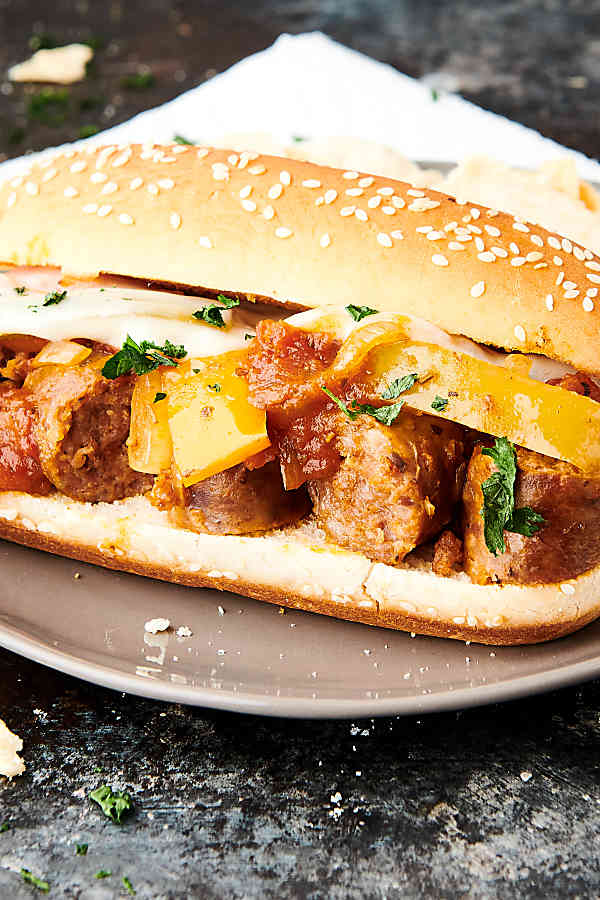 crockpot sausage and peppers sandwich on plate
