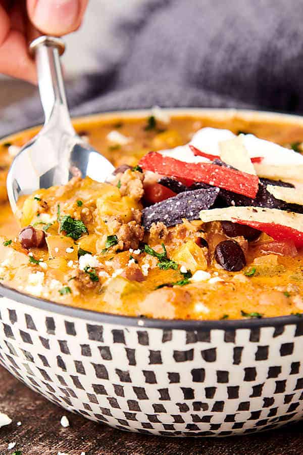 bowl of instant pot taco soup with spoon dipped in side view