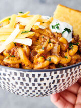 bowl of crockpot goulash held