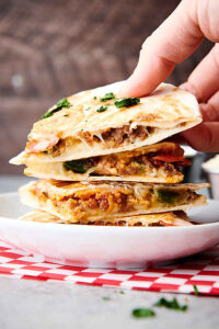 three slices of pizza quesadilla stacked