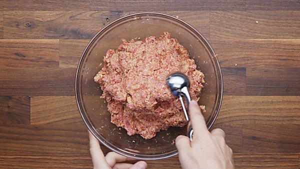 beef and sausage added to mixing bowl