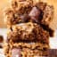 three coconut flour chocolate chip cookies stacked