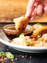 potsticker being dipped in sauce