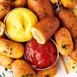 air fryer corn dogs on plate above