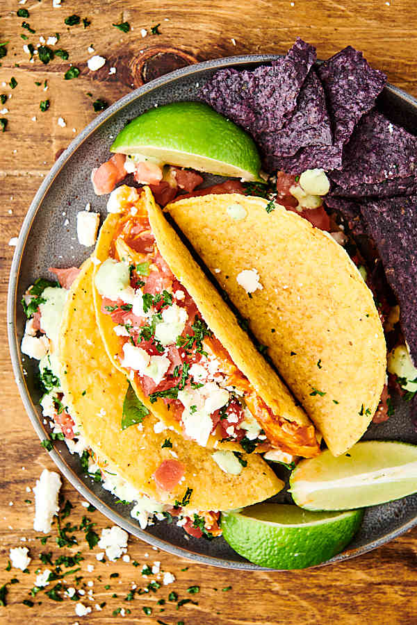 plate of instant pot salsa chicken tacos above