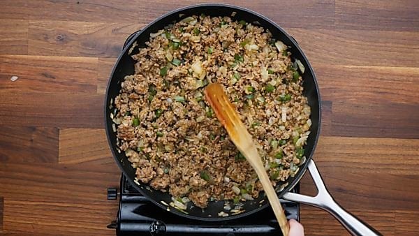 italian sausage, onion, and pepper cooked in skillet