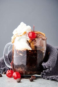vegan mug cake topped with whipped cream side view