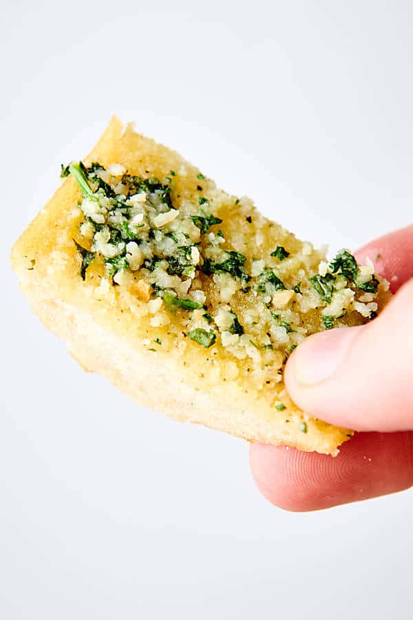 piece of garlic bread held