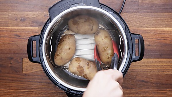 cooked potatoes being taken out of instant pot