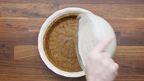 filling being poured onto pie crust