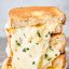 three halves air fryer grilled cheese sandwich stacked