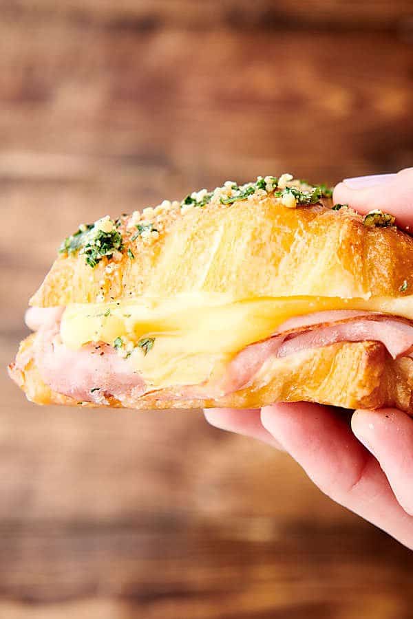 ham and cheese croissant held