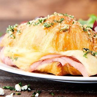 ham and cheese croissant on plate