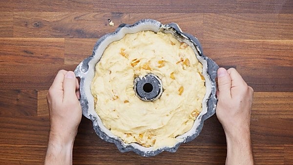 peach pound cake batter in bundt pan