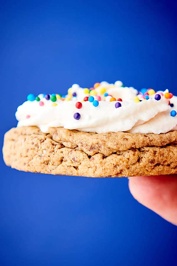 vegan buttercream frosting on cookie held