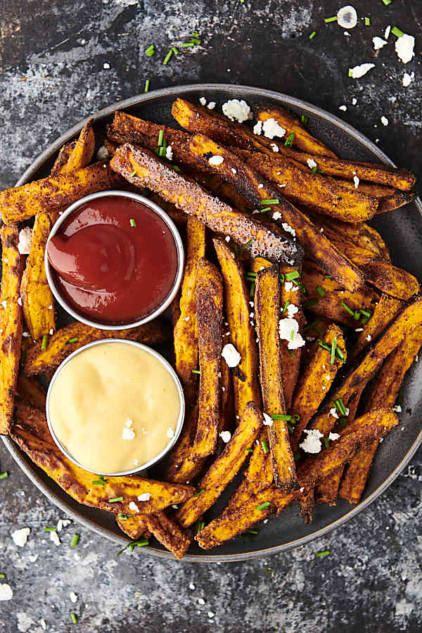 plate of air fryer sweet potato fries with 2 dipping sauces