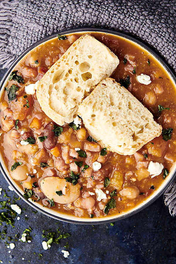 15 bean soup in a bowl with slices of baguette