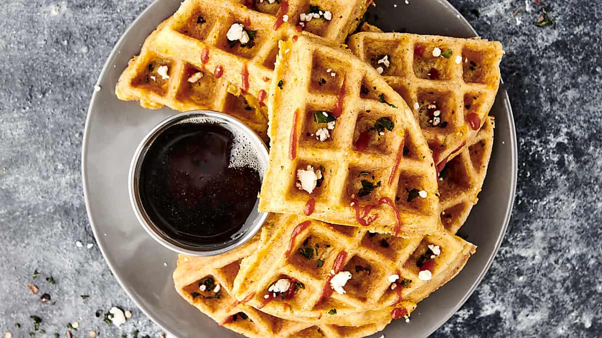 plate of chaffles with maple syrup for dunking