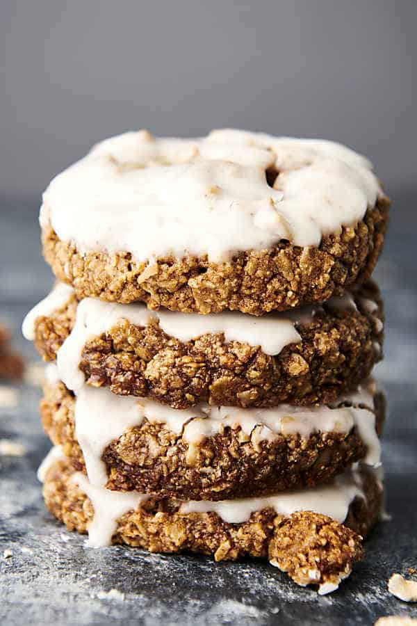 four iced oatmeal cookies stacked