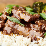 close up of instant pot mongolian beef topped with green onions