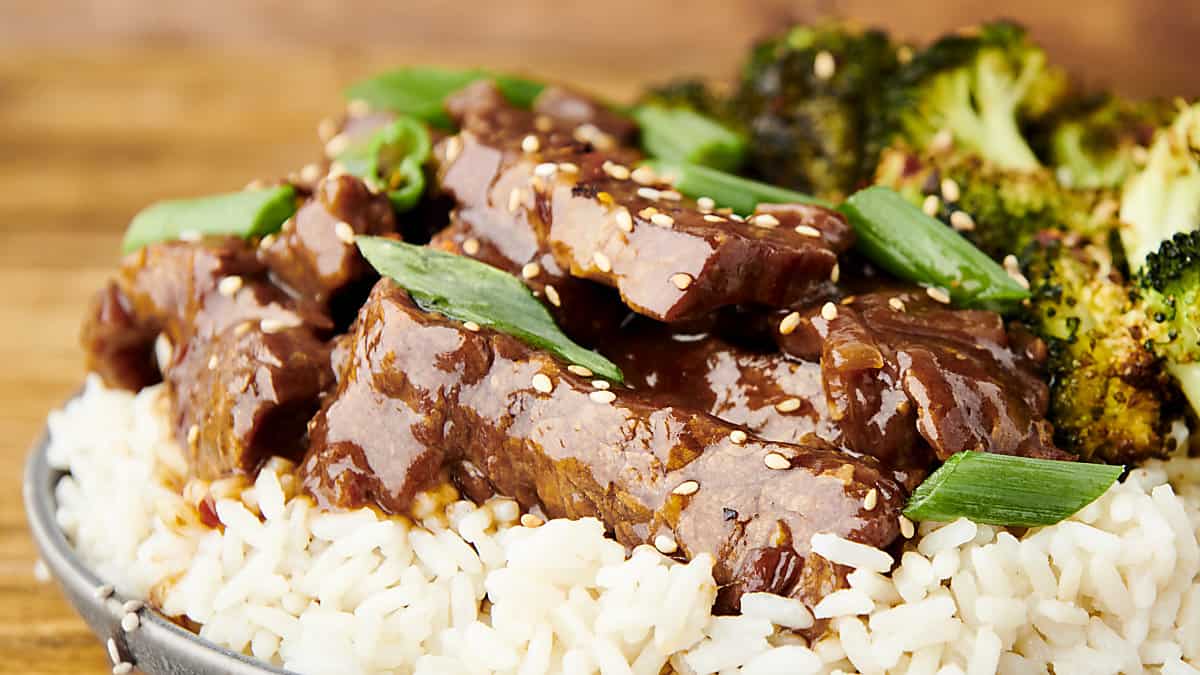 close up of instant pot mongolian beef topped with green onions