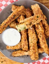 air fryer pickles on a plate with ranch