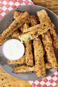 air fryer pickles on a plate with ranch