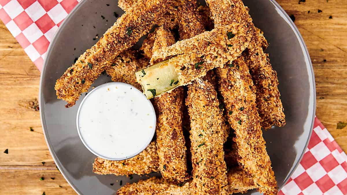 air fryer pickles on a plate with ranch for dipping