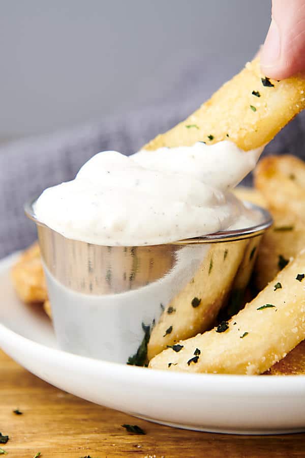 french fry dipping into truffle aioli