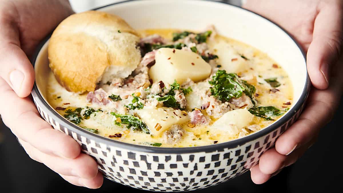 bowl of zuppa toscana soup with bread for dunking