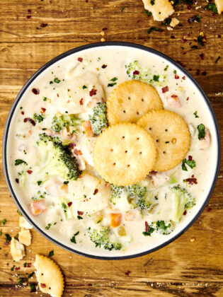 broccoli potato soup topped with crackers