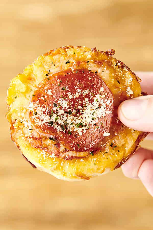holding a pepperoni pizza cupcake